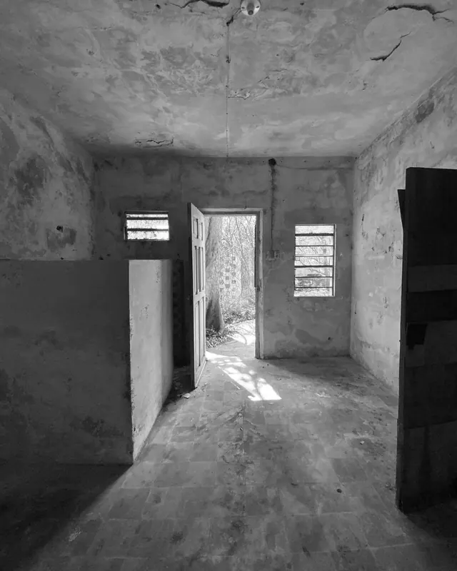 Room with a door to the garden before renovation