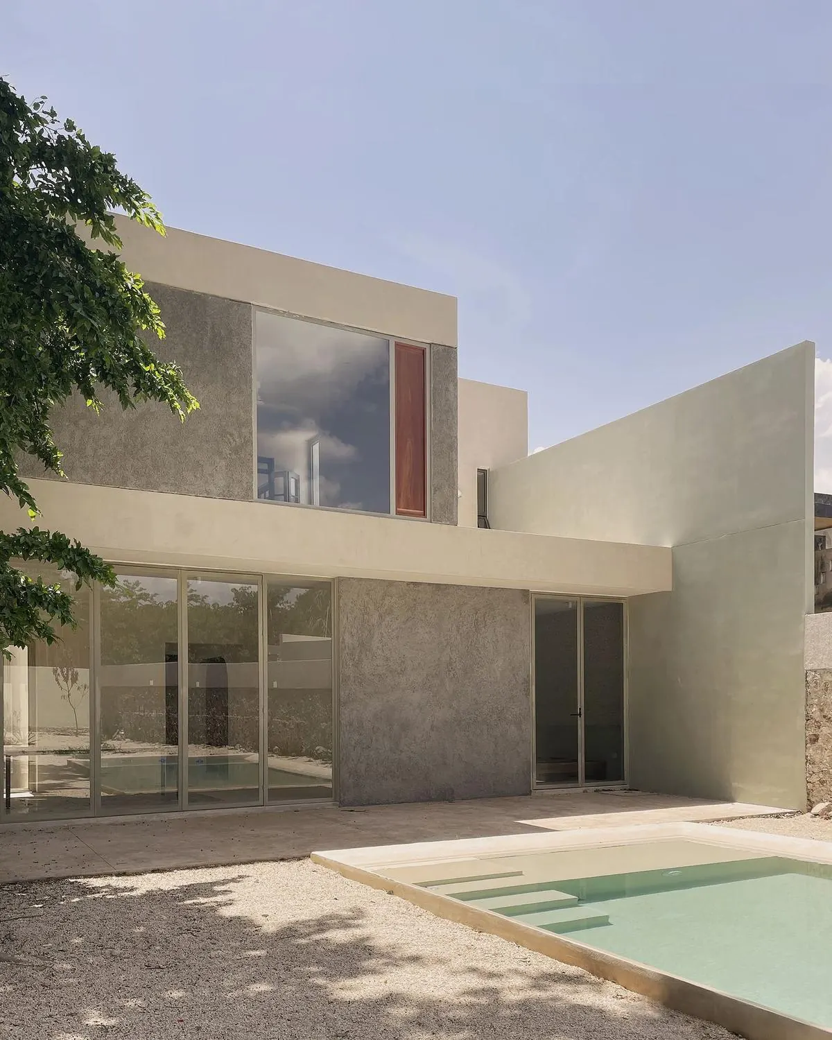 Two-storey contemporary house with pool and textured walls
